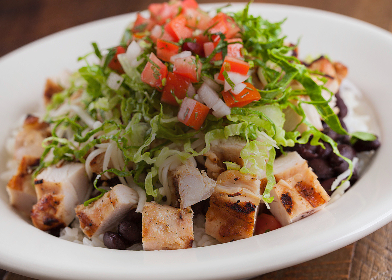 Baja bowl with rice, beans, protein and fresh toppings